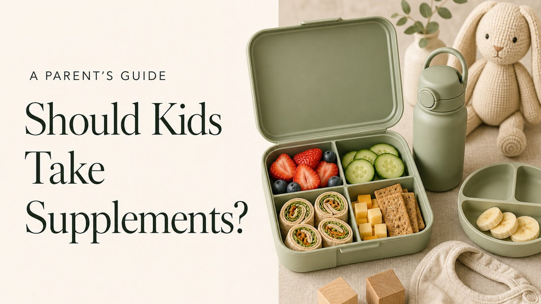 A sage-green children’s lunchbox filled with fruit, vegetables, wrap pinwheels and crackers beside a water bottle, knit bunny, bib and wooden blocks. Headline: Should Kids Take Supplements?